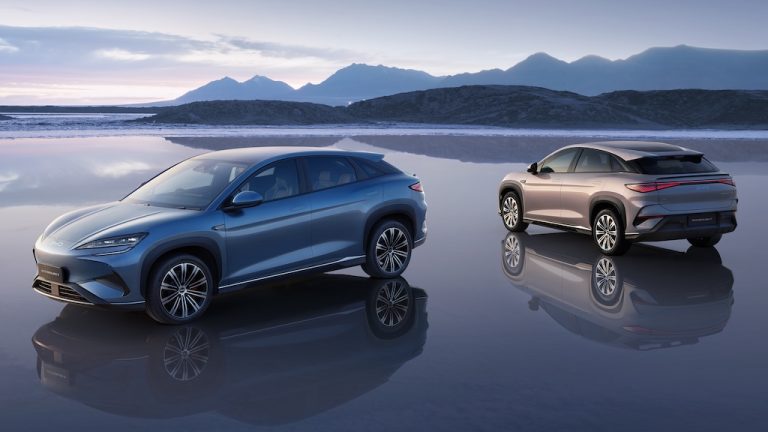 Two BYD Sealion 7 cars on a beach
