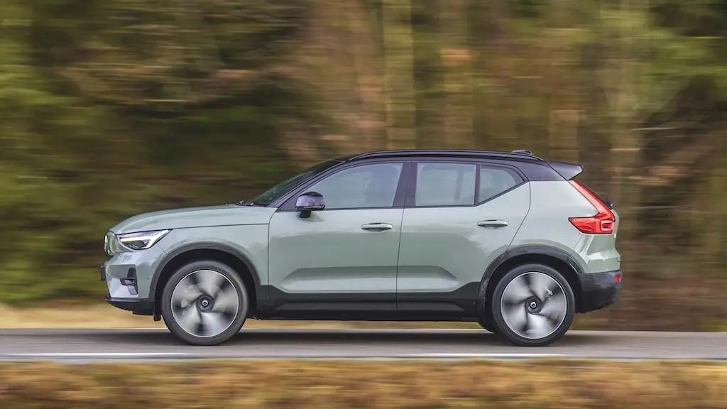 A Volvo XC40 Recharge in profile, driving