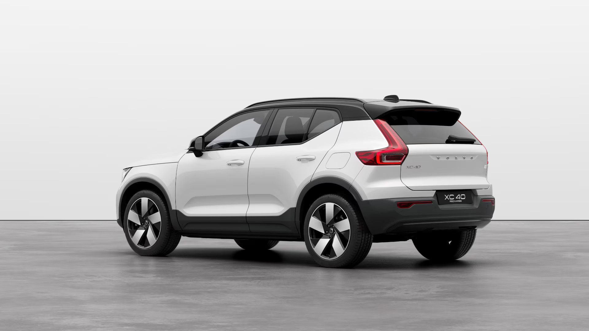 A rear-three-quarter shot of a white Volvo XC40 Recharge.