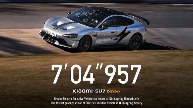 A silver Xiaomi SU7 Ultra flying low on the Nürburgring