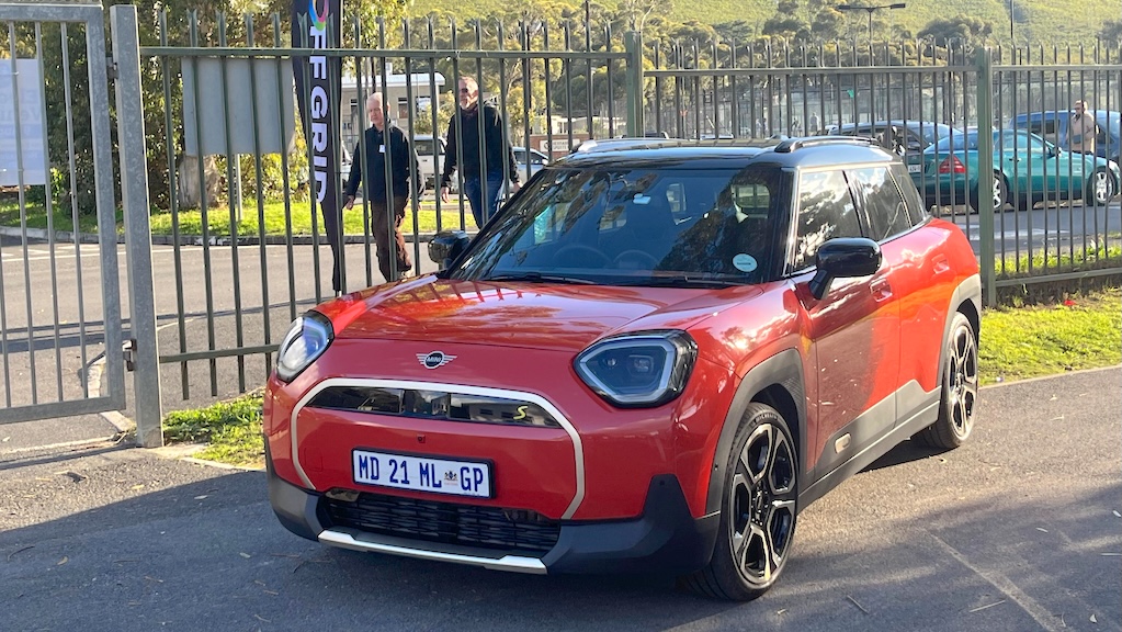 A MINI Aceman EV in a attention-grabbing orange/red colour