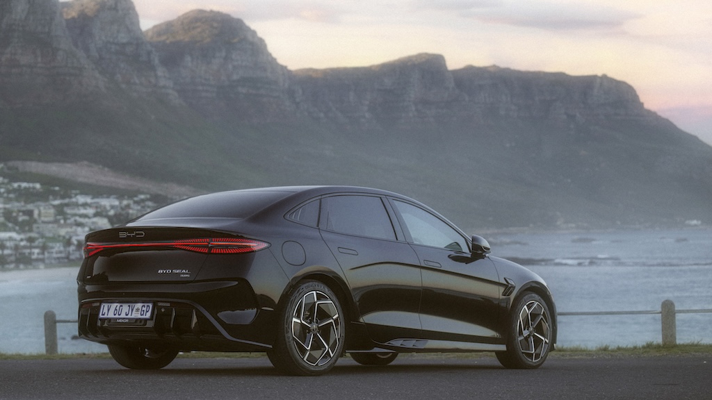 BYD Seal from rear angle with Camps Bay and Twelve Apostles backdrop