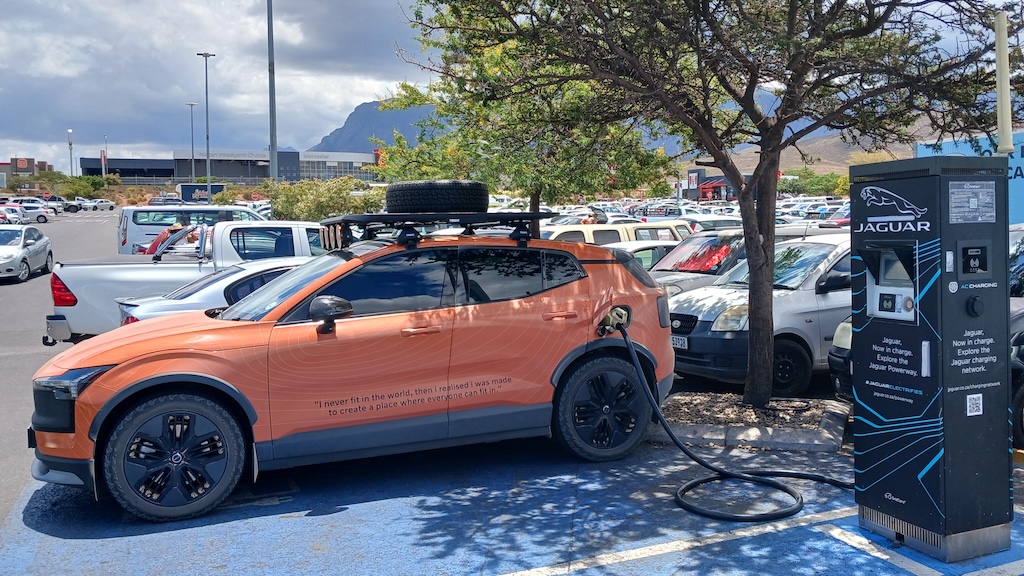 Orange EX30 Cross Country plugged in, charging Worcester