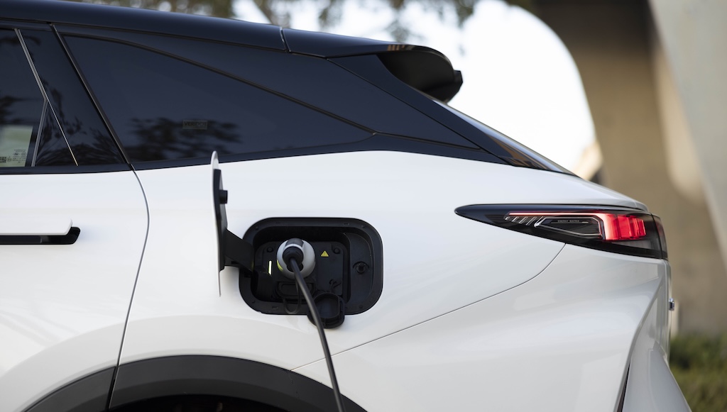 Charging cable plugged into port of Omoda C9