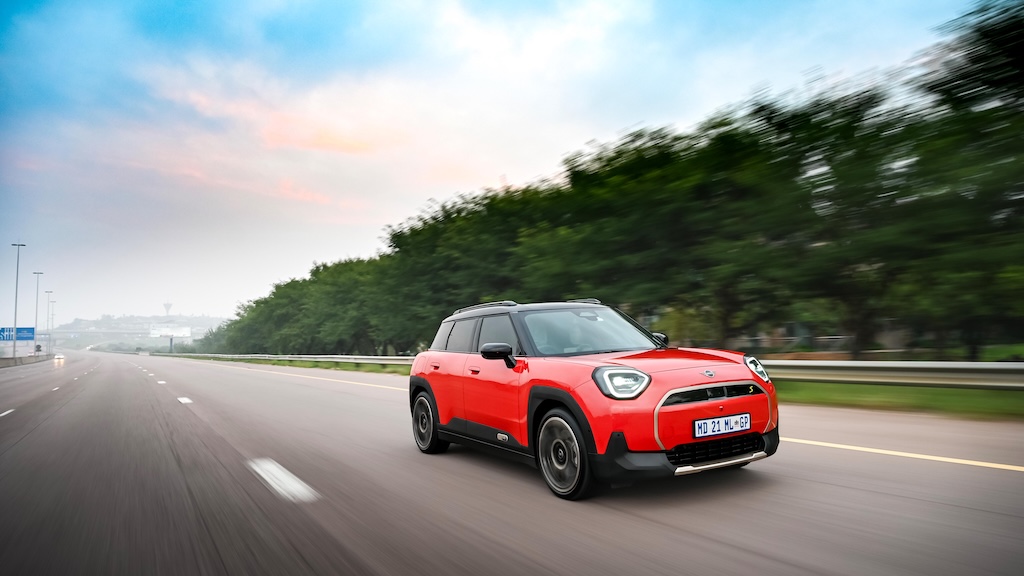 Red MINI Aceman on freeway