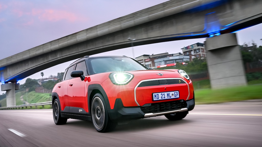 Red MINI Aceman SE on highway