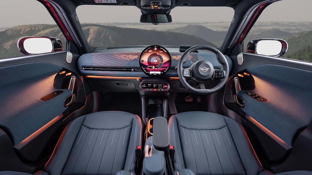 MINI Aceman interior at night, seen from rear seat