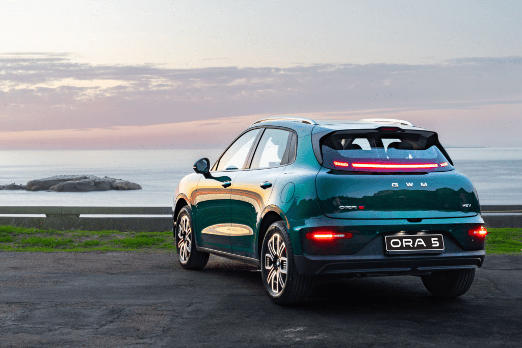 Rear view of the ORA 5, highlighting its full-width integrated rear light bar and rounded tail design.