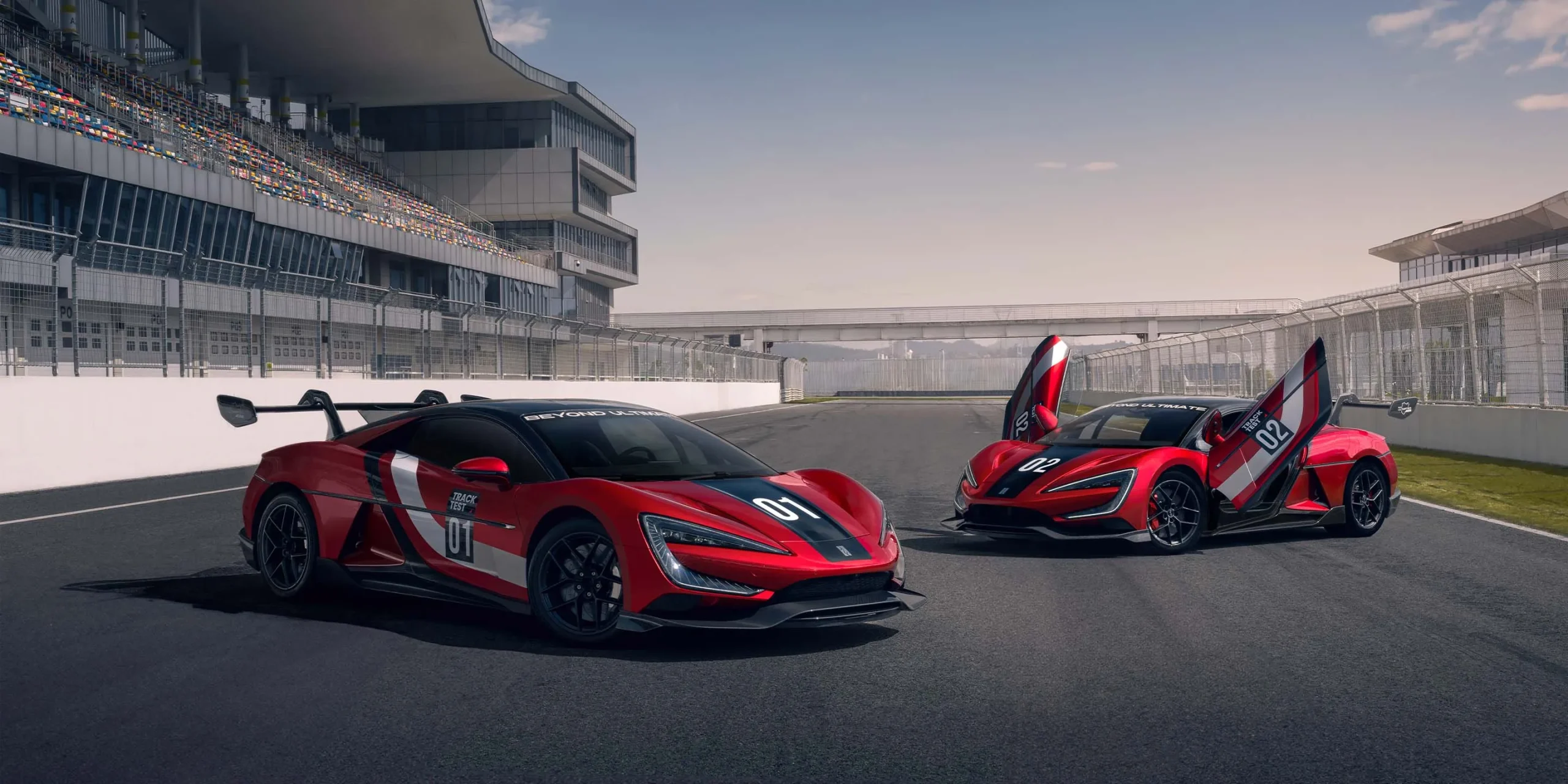 Two red Yangwang U9 Xtreme cars on a race track